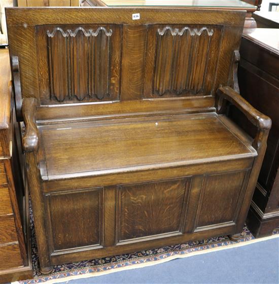 An oak monks bench W.106cm